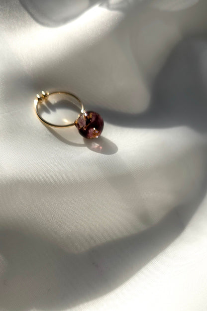 10mm orb ring in dark cherry, SAKURAMBO ring on a flat surface.