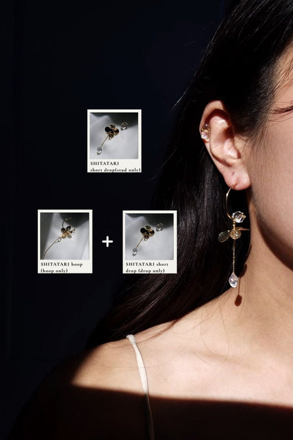Model wearing a combination of gold floral earring, SHITATARI short drop, SHITATARI hoop.