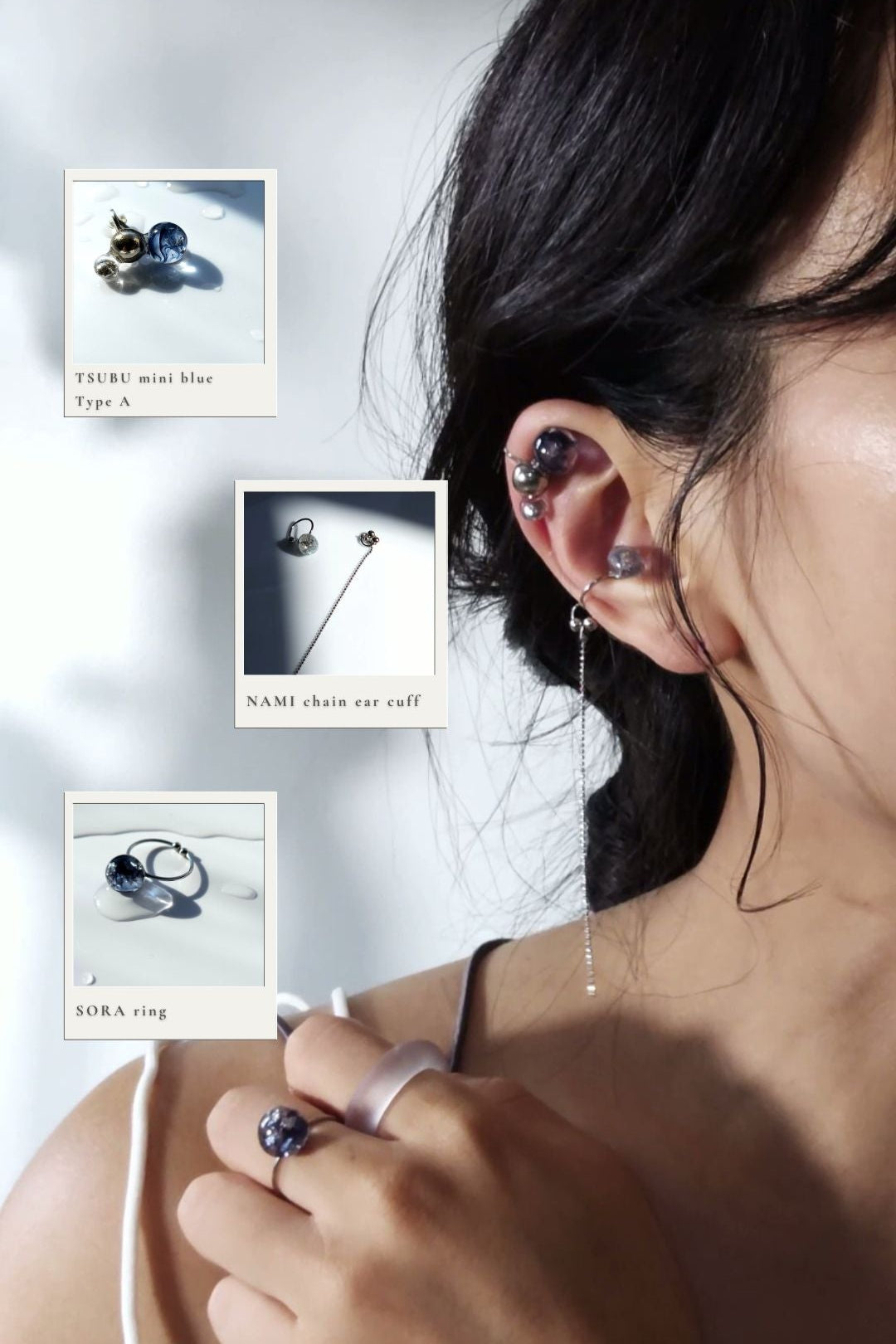 Model wearing TSUBU mini blue on helix aith NAMI multiway chain earcuff on cartilage, and SORA blue orb ring on the middle finger.