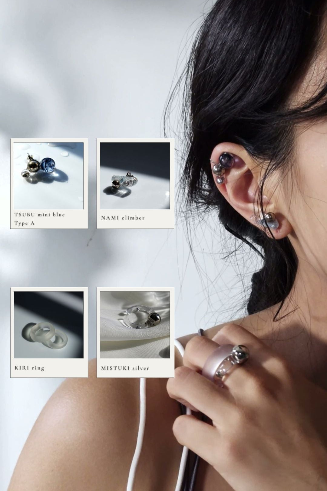 Close-up of a person wearing NAMI climber on earlobe, TSUBU mini blue orb climber on helix, KIRI frosty matte ring with MITSUKI silver orb ring on middle finger.