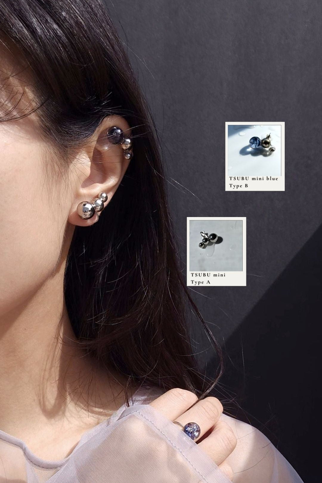 Close-up of a person wearing TSUBU mini silver Type A on the earlobe with TSUBU mini blue Type B on the helix